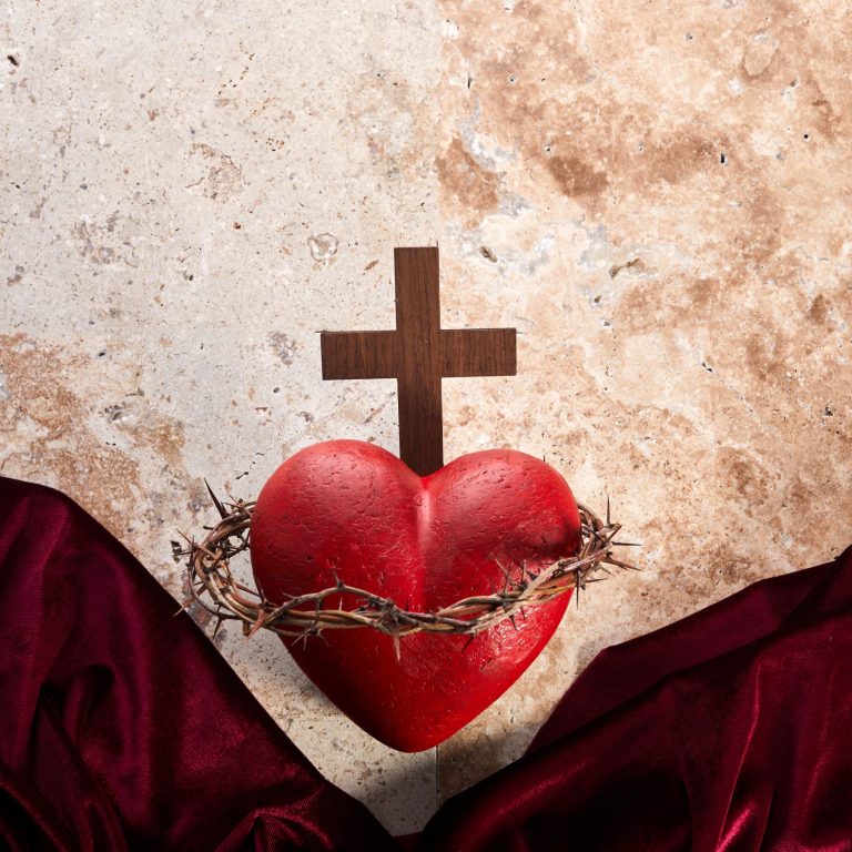 Sacred Heart of Jesus, surrounded by a crown of thorns and with wooden cross.